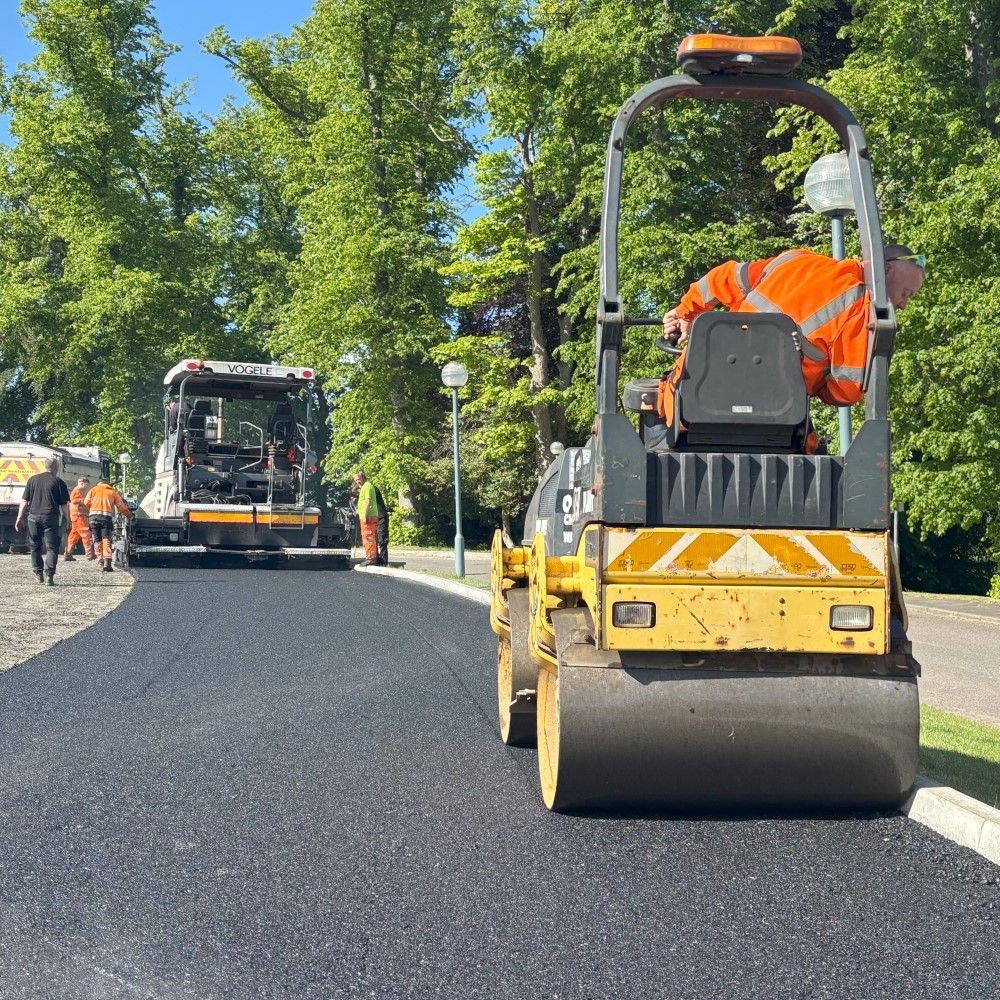 Following the machine with the roller to get a tidy edge