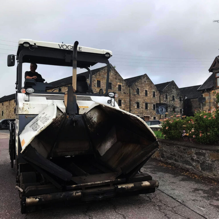 Trevor Harris paver in front of an old industrial building