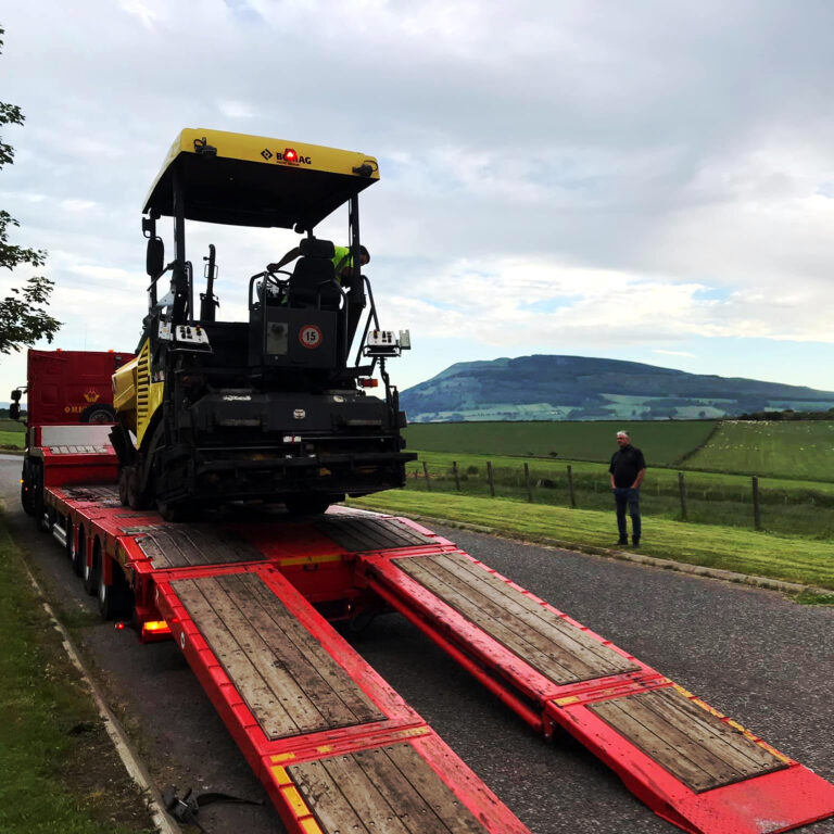 Trevor Harris' Bomag paver being unloaded