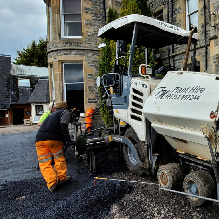 Trevor Harris Vogele 1303 working outside the Loch Ness Centre